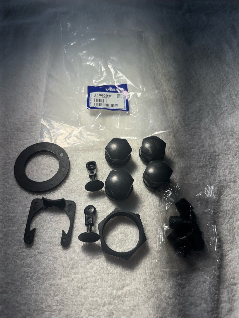 Lot Of Components of a Volvo Wheel Bolt Cap Kit #31660916